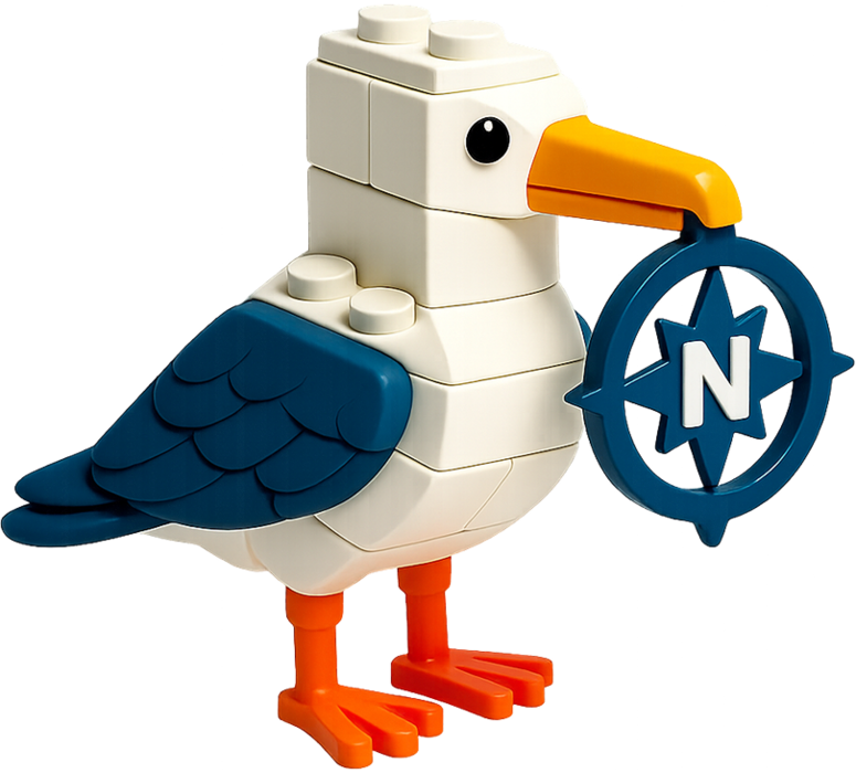 Möwe aus Klemmbausteinen mit einem blauen Kompass im Schnabel